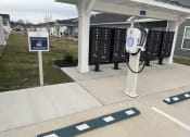 Thumbnail 17 of 17 - a gas pump in front of a gas station